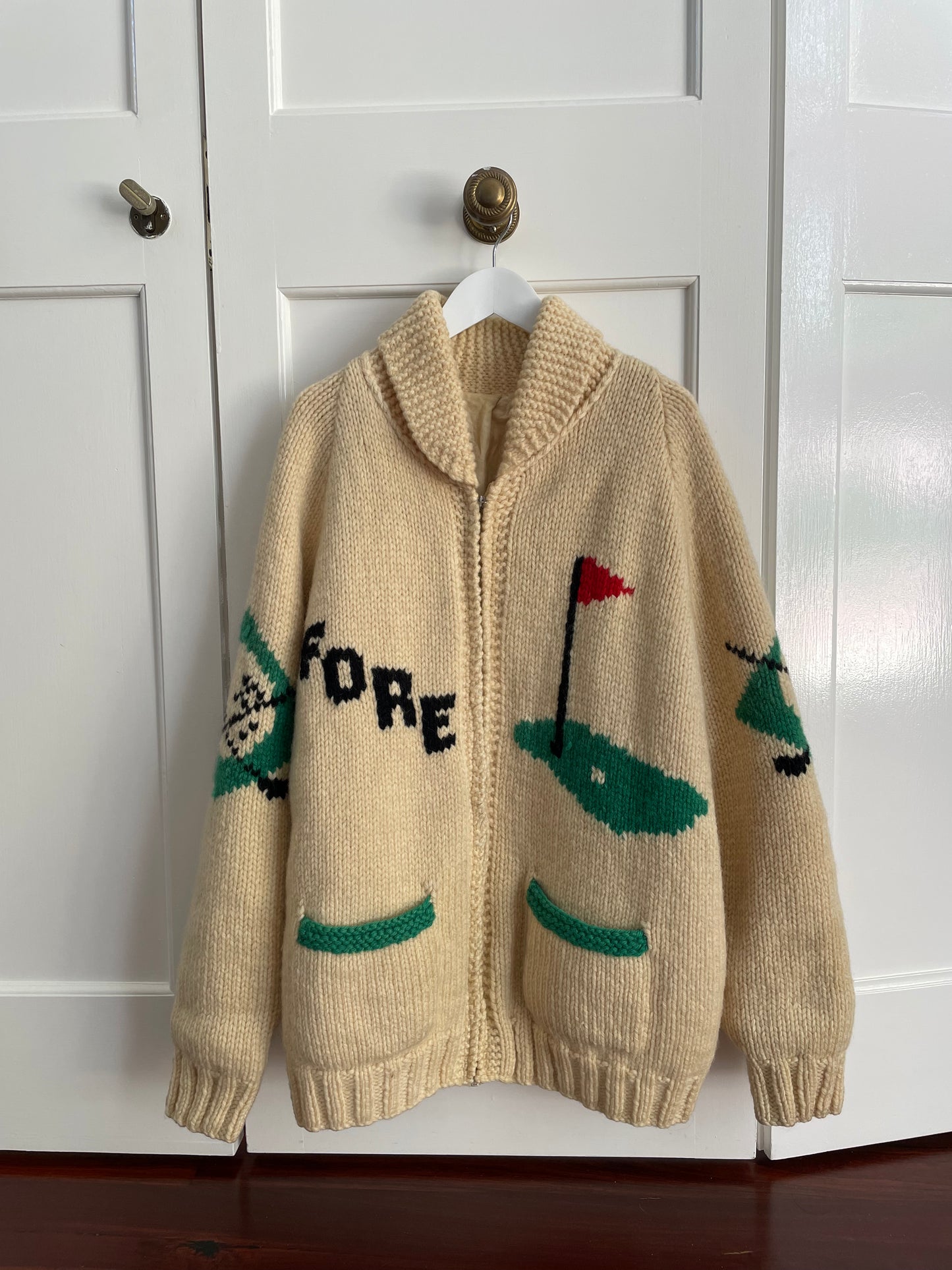 Rare vintage 60s ivory Cowichan hand knit wool cardigan sweater with golf motifs.