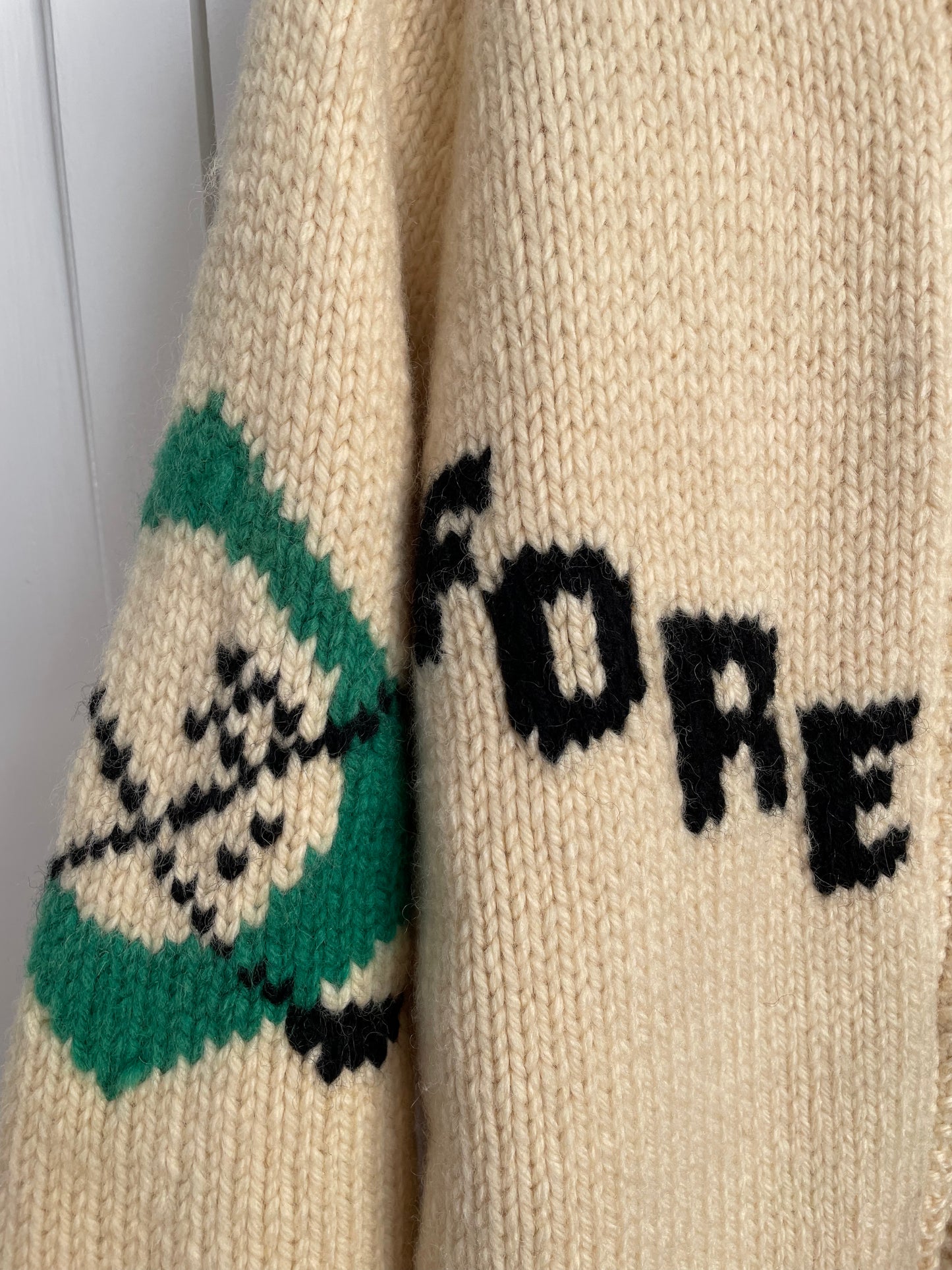 Rare vintage 60s ivory Cowichan hand knit wool cardigan sweater with golf motifs.